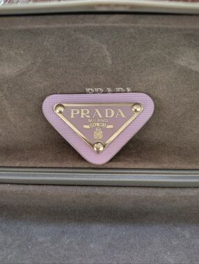 Prada Triangular Logo Button in Lavender and Silver. Off A Prada Bag.